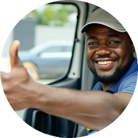 A smiling port delivery driver giving a thumbs up