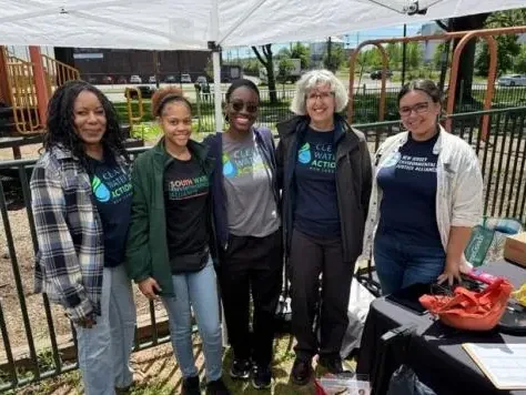 Clean Water Action and South Ward Environmental Alliance staff at a community truck-count table